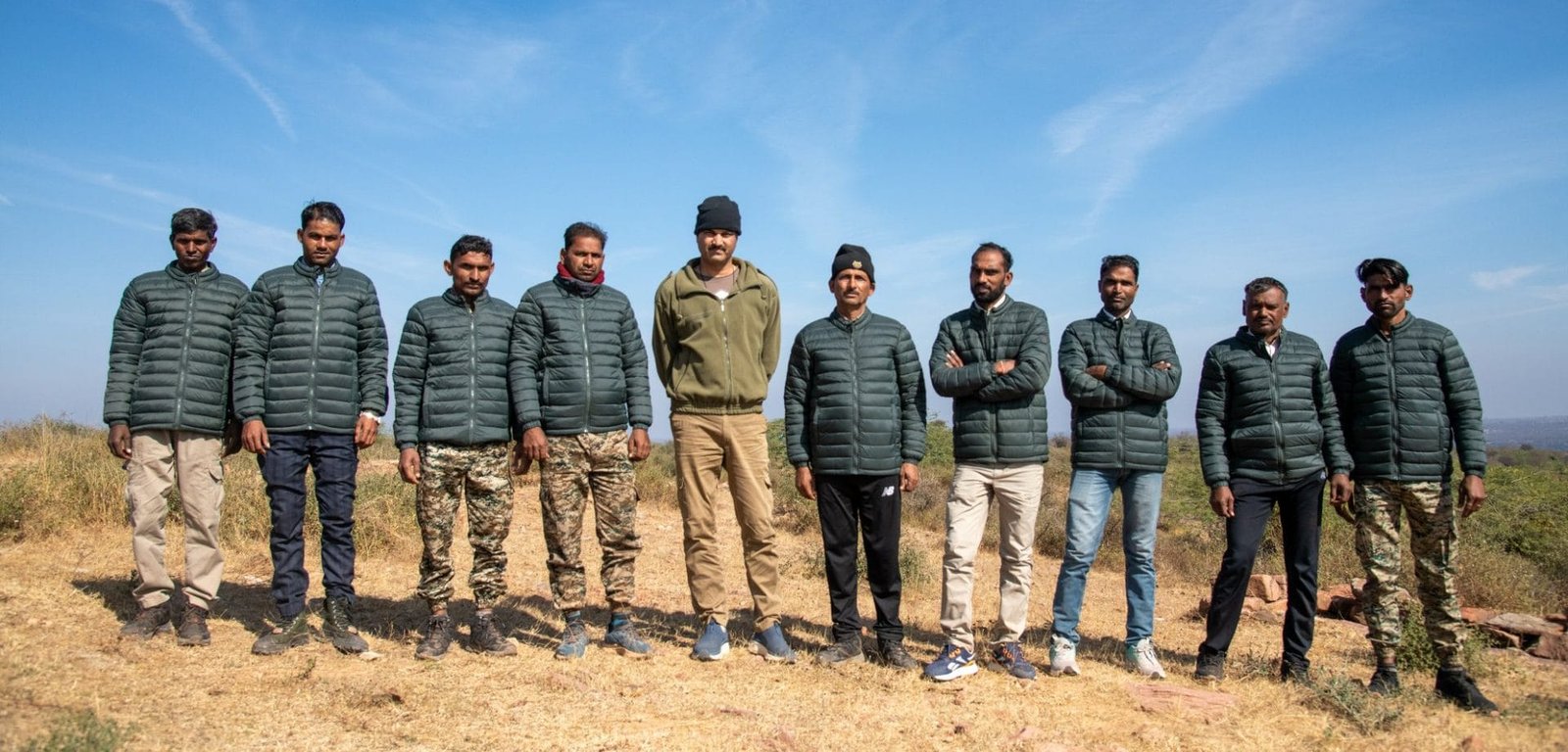 Tiger Watch field team standing together on a hilltop in the Ranthambhore landscape, Rajasthan